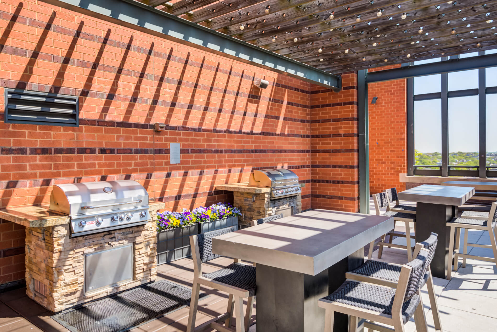 Two grilling stations with adjoining tables