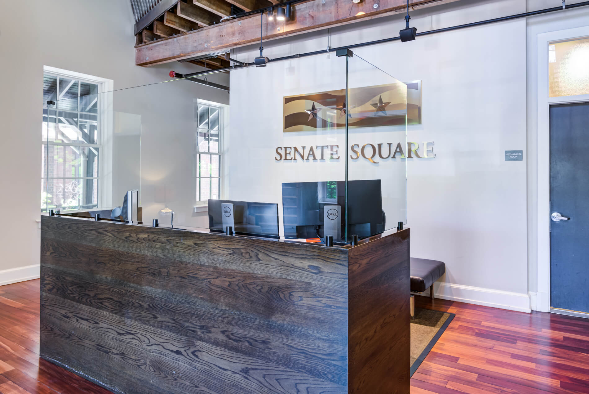 Lobby with concierge desk and Senate Square logo wall art